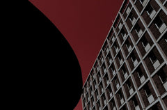 Dramatic black and deep red architectural abstract photography print with a minimalist curve, titled Simply Red.
