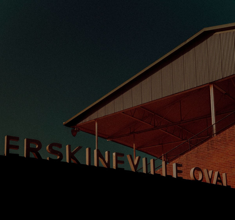 Moody, high-contrast fine art photography print of the iconic Erskineville Oval stadium sign in Sydney, Australia.