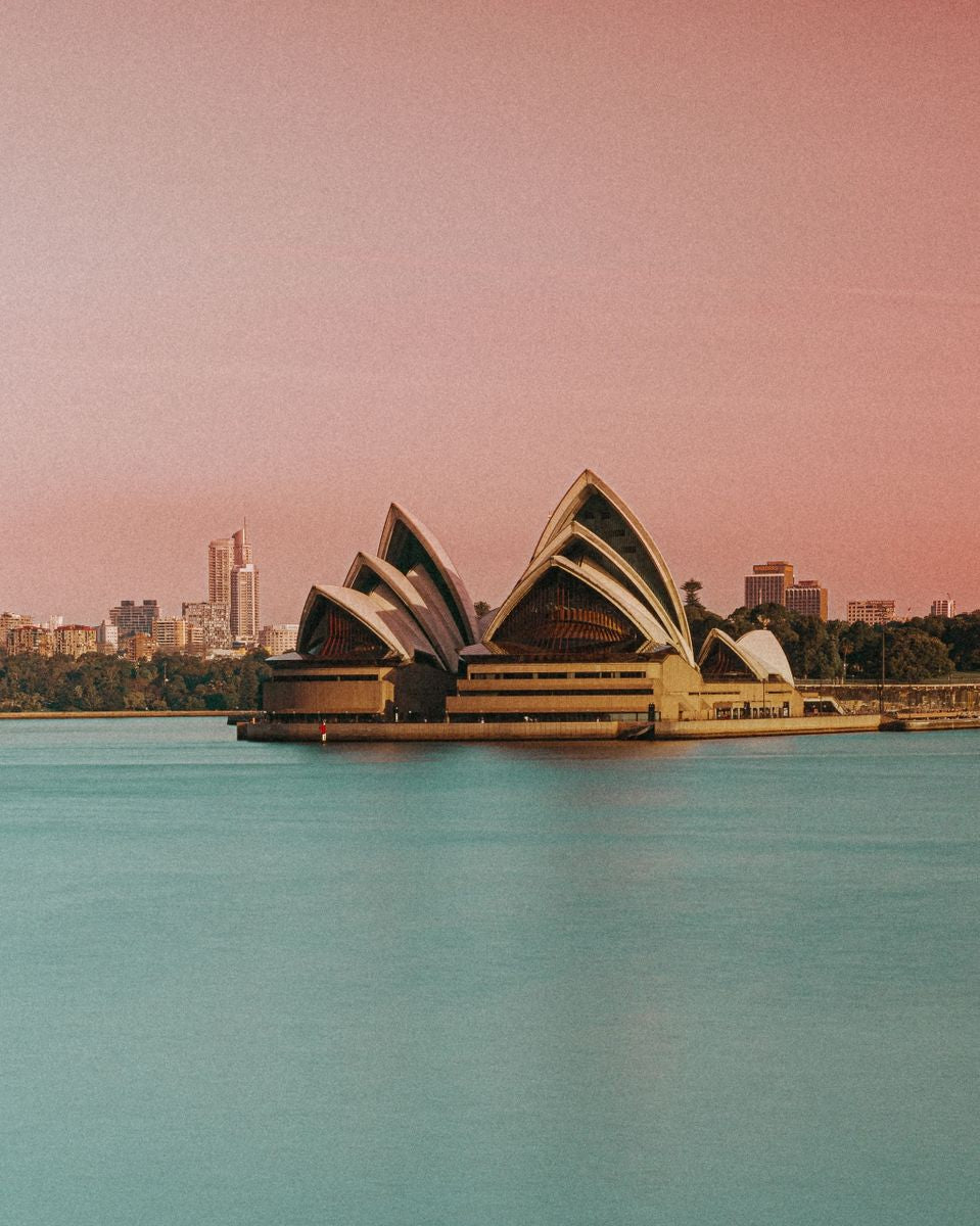 Vibrant pink and teal abstract architectural photography print of the iconic Sydney Opera House and skyline.